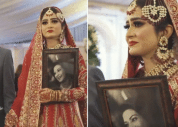 വിവാഹത്തിന് കൈപിടിച്ച് വേദിയിലെത്തിക്കാൻ അമ്മയില്ല; പകരം ഫോട്ടോ നെഞ്ചോട് ചേർത്ത് പിടിച്ച് വധു; കണ്ണുനനയിച്ച് ചിത്രം